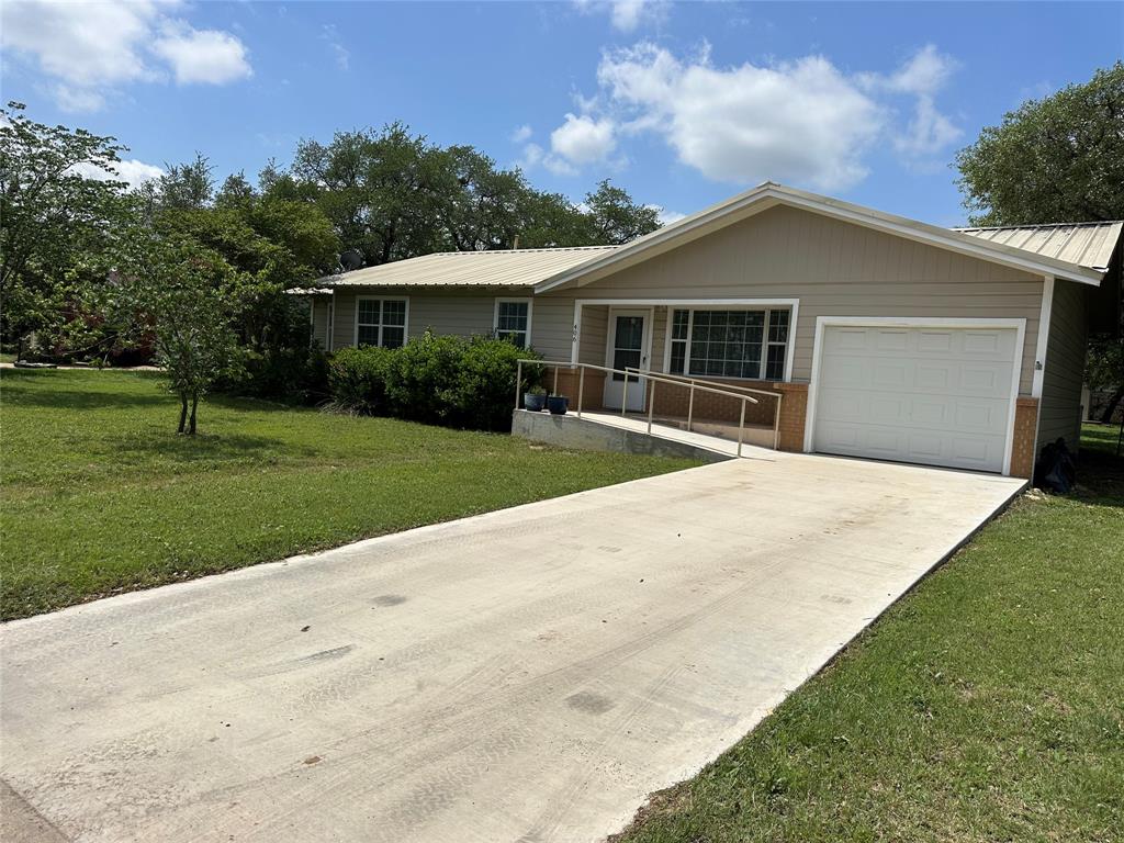 406 South Williams Street Hamilton, TX 76531 - Photo 2 of 35 a front view of a house with a yard and trees