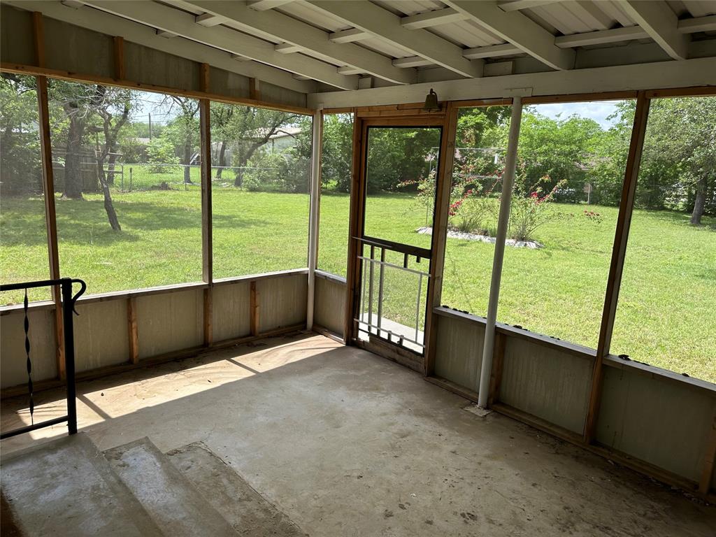 406 South Williams Street Hamilton, TX 76531 - Photo 29 of 35 a view of an empty room with large windows