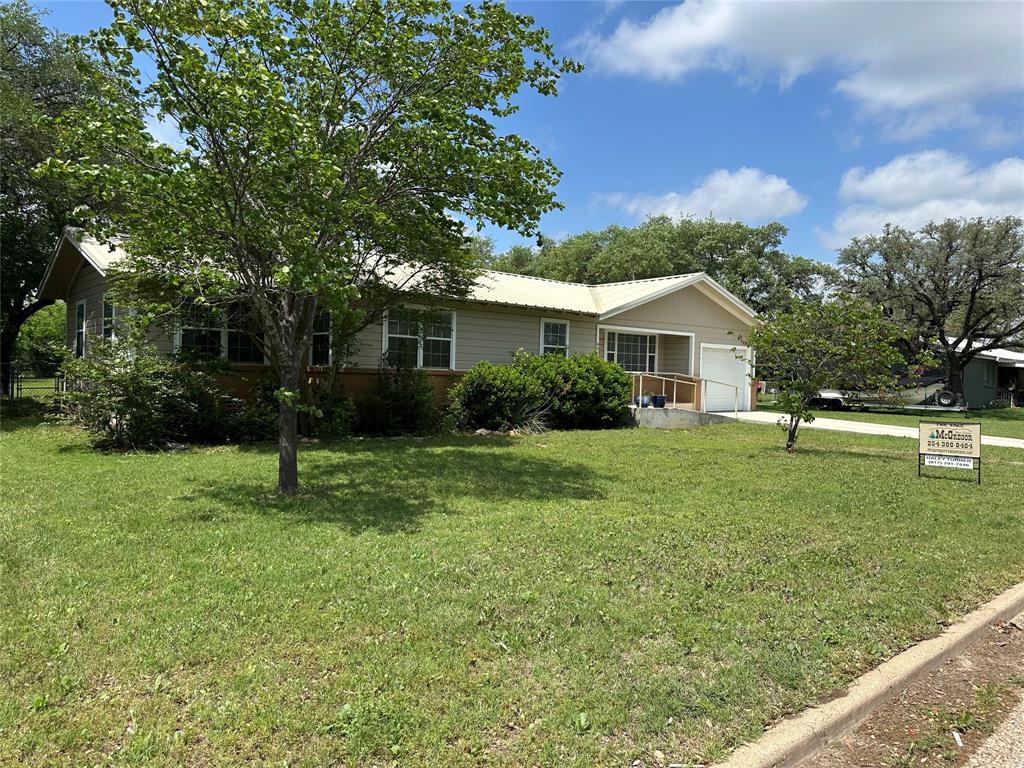 406 South Williams Street Hamilton, TX 76531 - Photo 3 of 35 a view of a house with a backyard