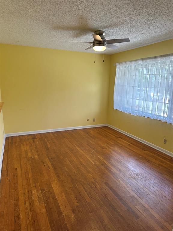 406 South Williams Street Hamilton, TX 76531 - Photo 4 of 35 a view of a room with wooden floor and a window