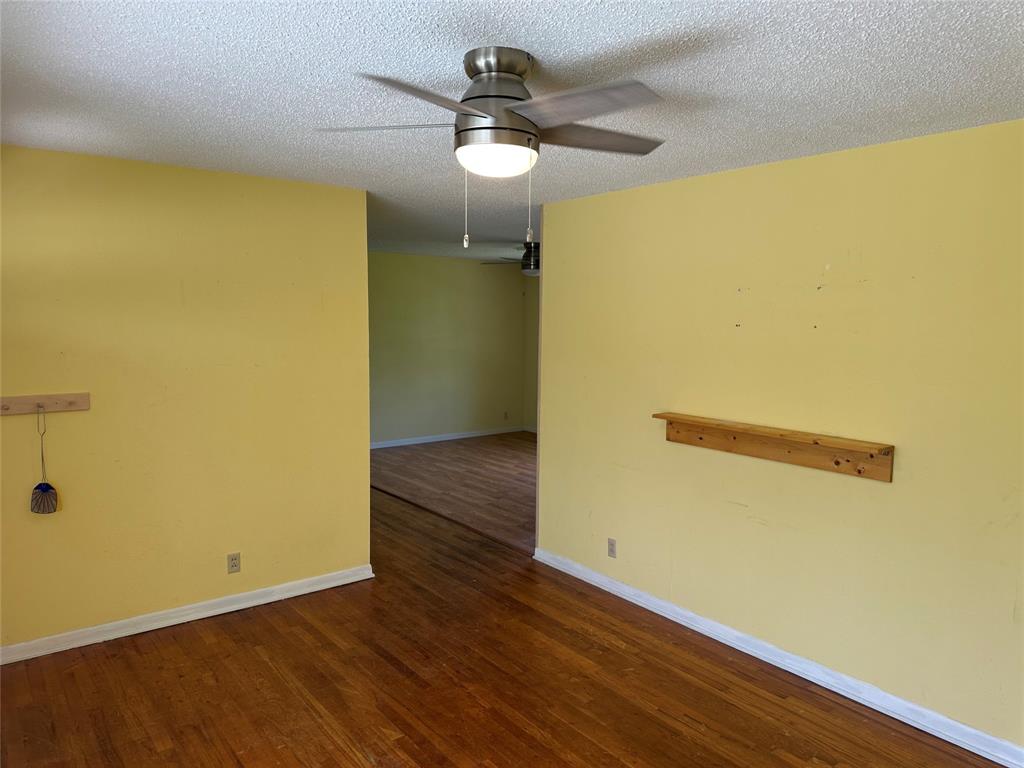 406 South Williams Street Hamilton, TX 76531 - Photo 6 of 35 a view of a room with wooden floor