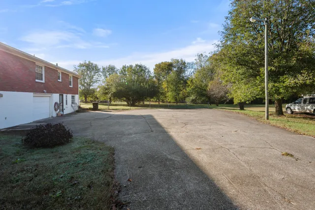 a view of a road with a building in the background