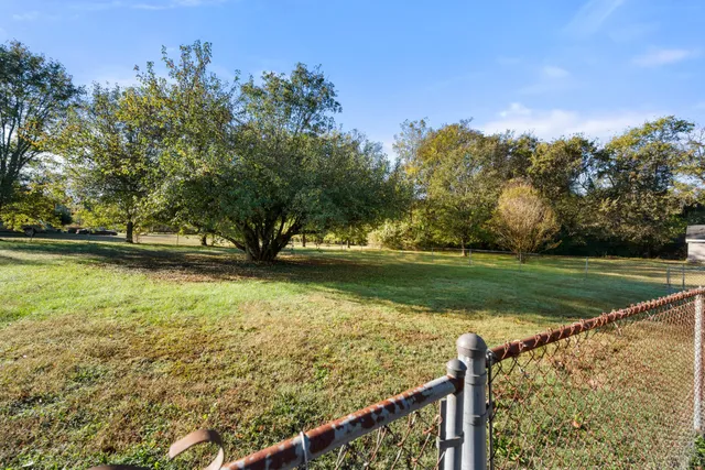 a view of a golf course with a lake