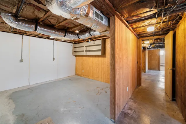 a view of a room with wooden walls