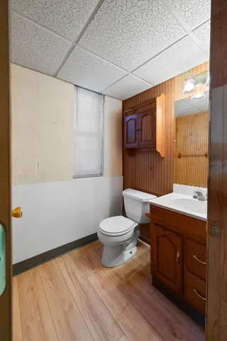 a bathroom with a sink toilet a mirror and shower