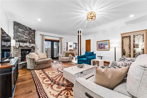 a living room with furniture and a chandelier