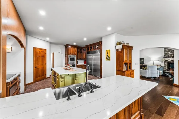 a room with furniture and kitchen view