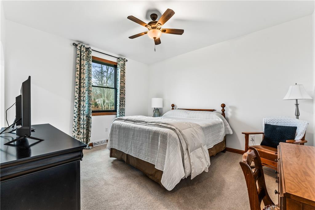 365 South Penn Road Franklin, PA 16323 - Photo 42 of 45 a spacious bedroom with a bed and a flat screen tv