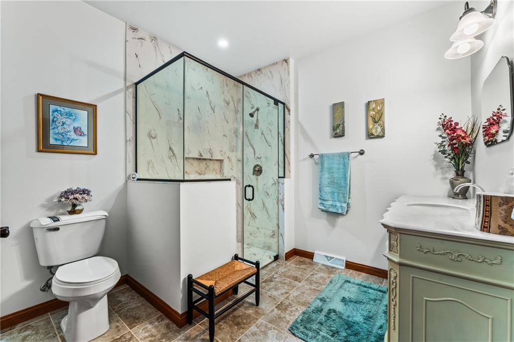 365 South Penn Road Franklin, PA 16323 - Photo 47 of 48 a bathroom with a granite countertop sink mirror vanity and toilet