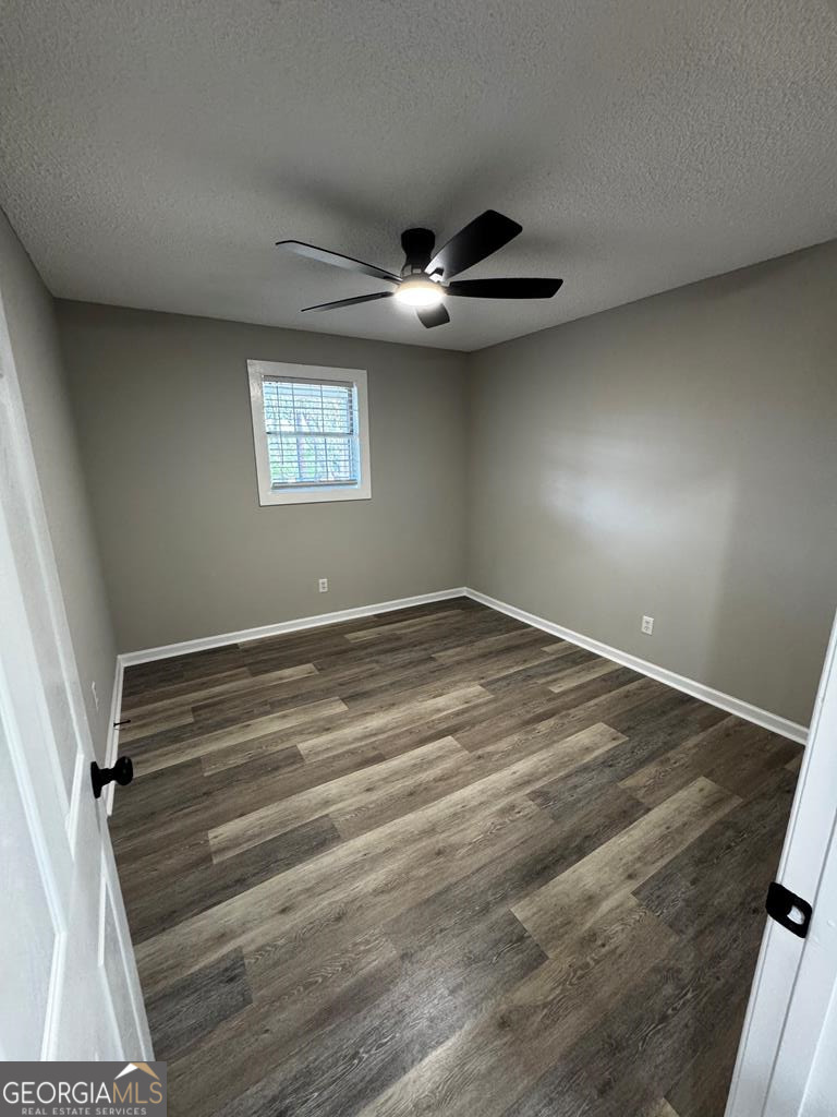 5781 Adams Road Valdosta, GA 31601 - Photo 16 of 27 wooden floor in an empty room