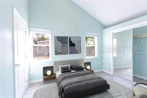 a bedroom with a bed and a view of bathroom