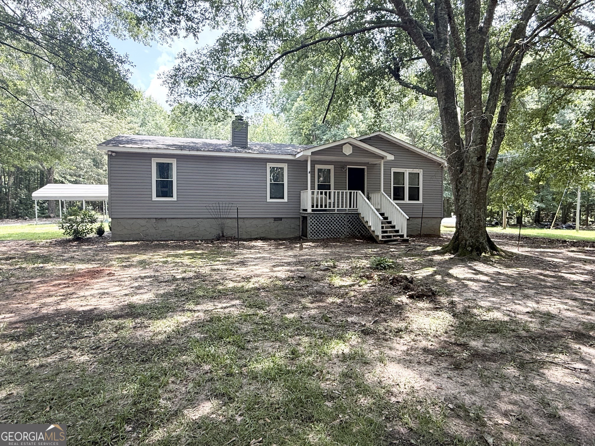 62 Melvin Harris Road Manchester, GA 31816 - Photo 1 of 52 a house that has a tree in front of it
