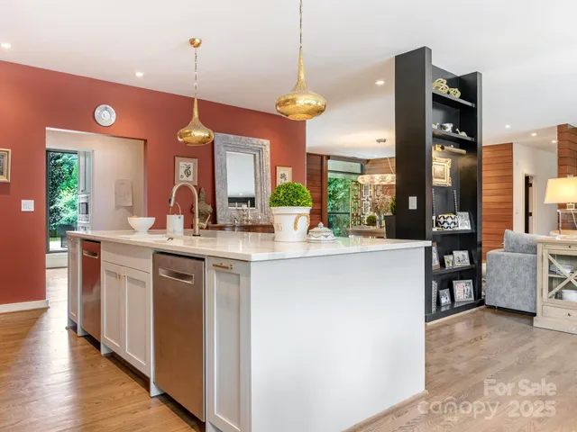 a kitchen with stainless steel appliances granite countertop a stove and a sink