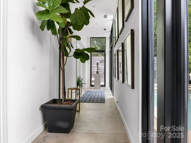 a vase of flowers sitting on a floor