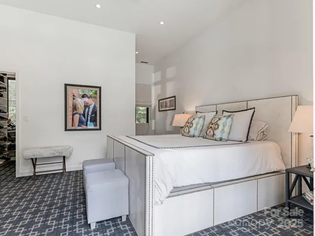 a bedroom with a bed and a couch