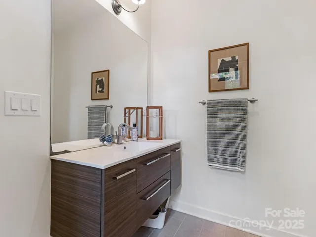 a room with a sink and a mirror