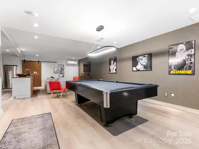 a kitchen with stainless steel appliances granite countertop a stove and a refrigerator