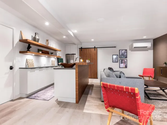 a living room with furniture and a table