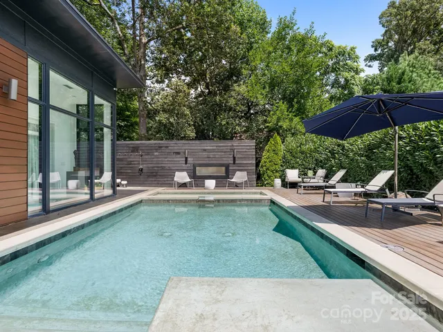 a view of a swimming pool with a patio