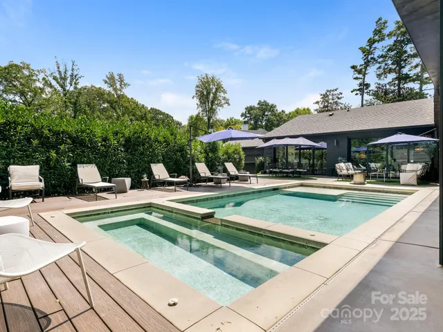 a view of swimming pool with chairs