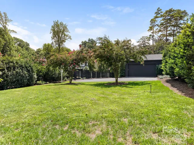 a swimming pool with outdoor seating and yard