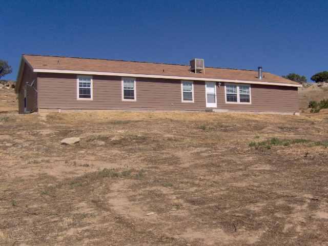a front view of a house with yard