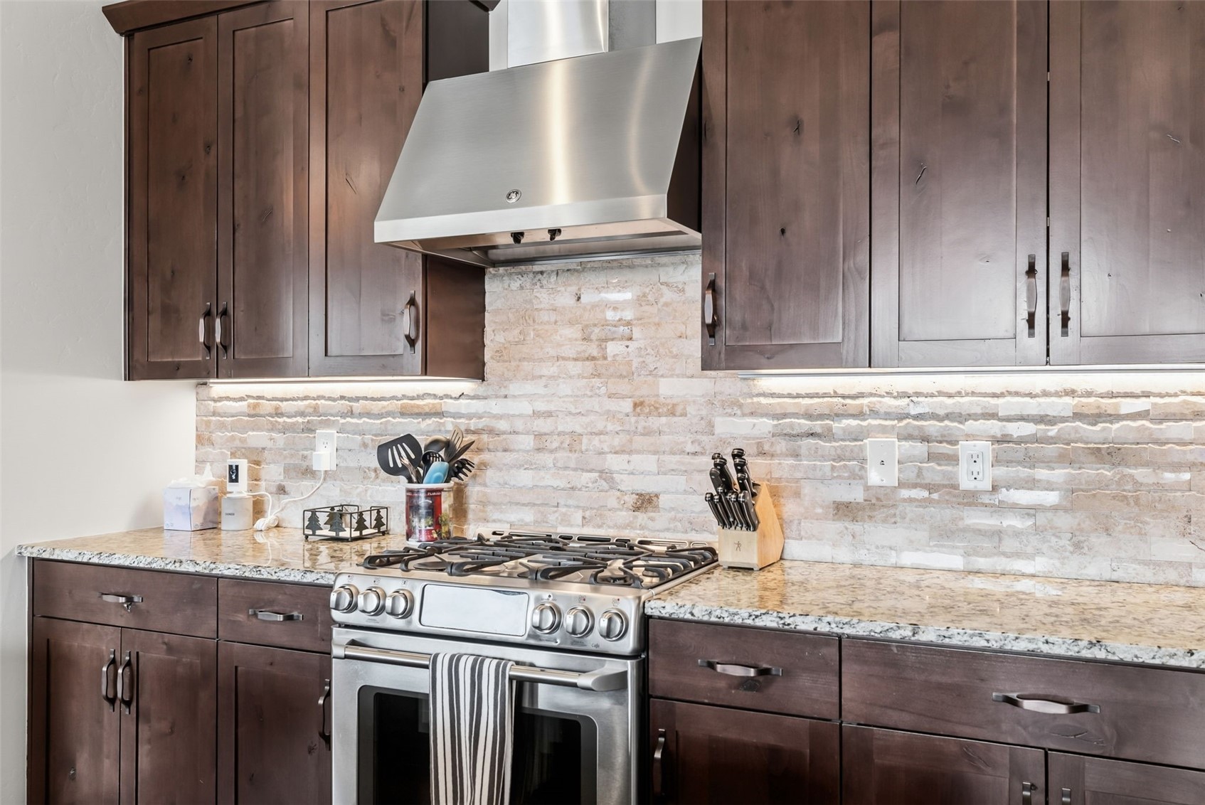 59 Erickson Loop, Unit 4B Keystone, CO 80435 - Photo 12 of 50 a kitchen with granite countertop stainless steel appliances a stove sink and cabinets