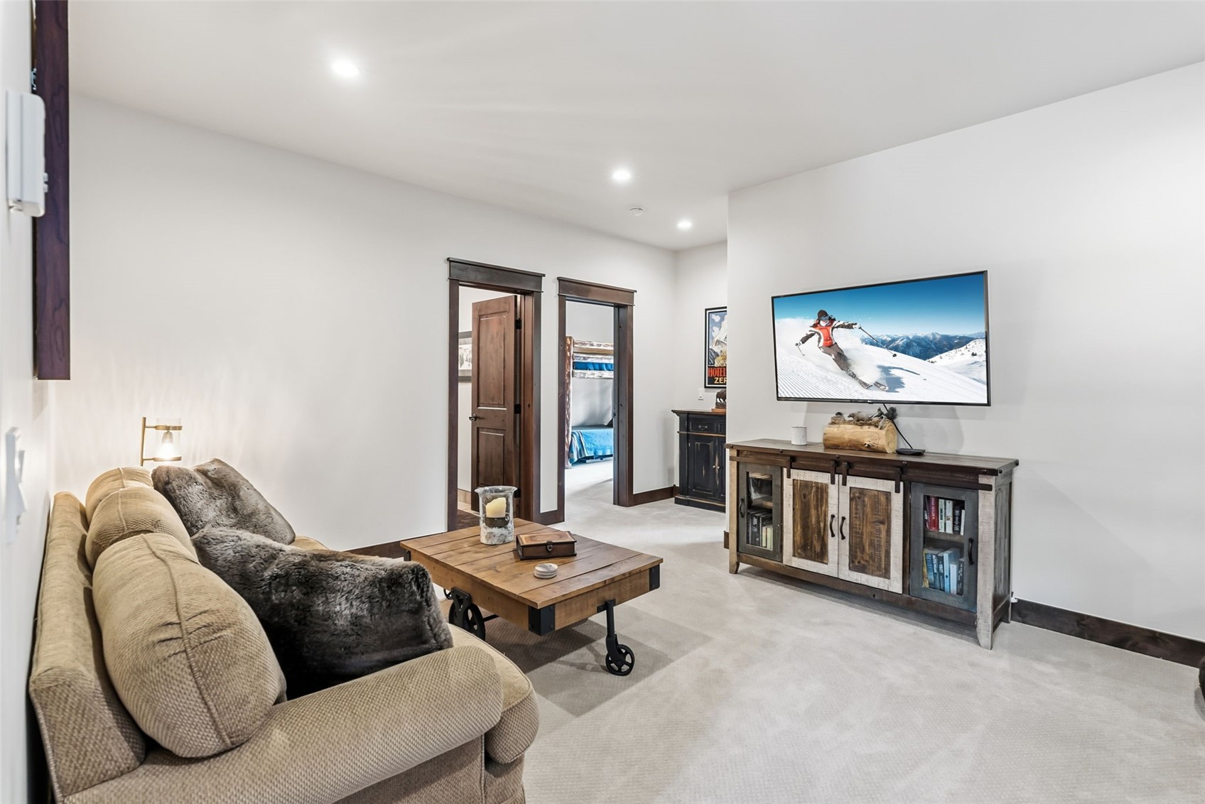 59 Erickson Loop, Unit 4B Keystone, CO 80435 - Photo 33 of 50 a living room with furniture and a flat screen tv