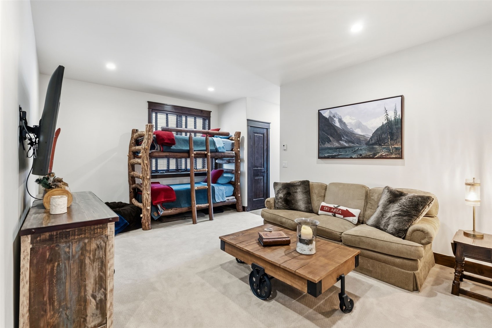 59 Erickson Loop, Unit 4B Keystone, CO 80435 - Photo 34 of 50 a living room with furniture and a bookshelf
