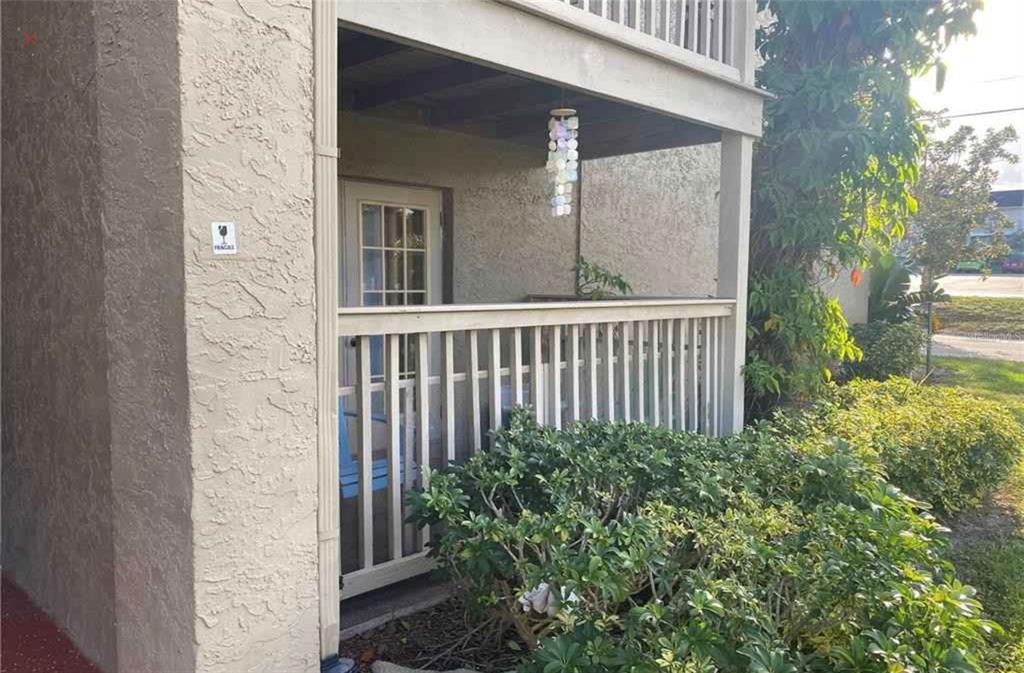 305 Wymore Road, Unit 103 Altamonte Springs, FL 32714 - Photo 1 of 1 a view of a porch with a yard