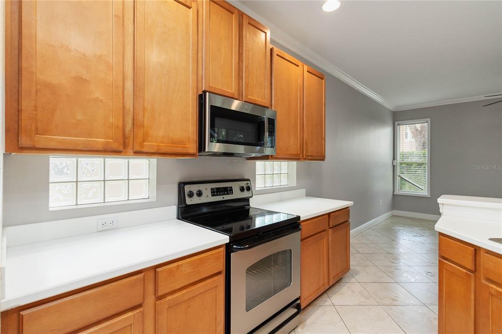 11322 Rapallo Lane Windermere, FL 34786 - Photo 14 of 39 a kitchen with a stove and a microwave
