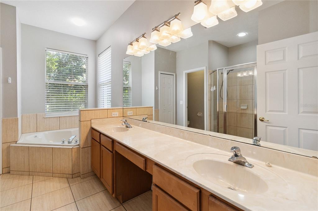 11322 Rapallo Lane Windermere, FL 34786 - Photo 16 of 39 a bathroom with a sink double vanity and a bathtub