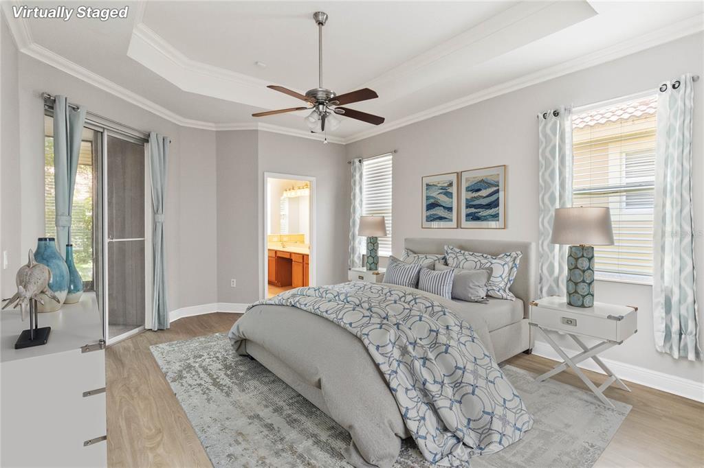 11322 Rapallo Lane Windermere, FL 34786 - Photo 18 of 39 a bedroom with a large bed and a window