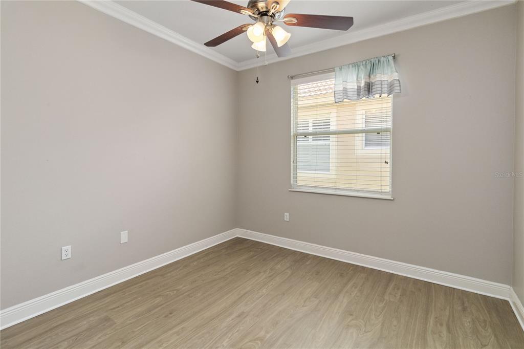 11322 Rapallo Lane Windermere, FL 34786 - Photo 21 of 39 an empty room with a window and a fan