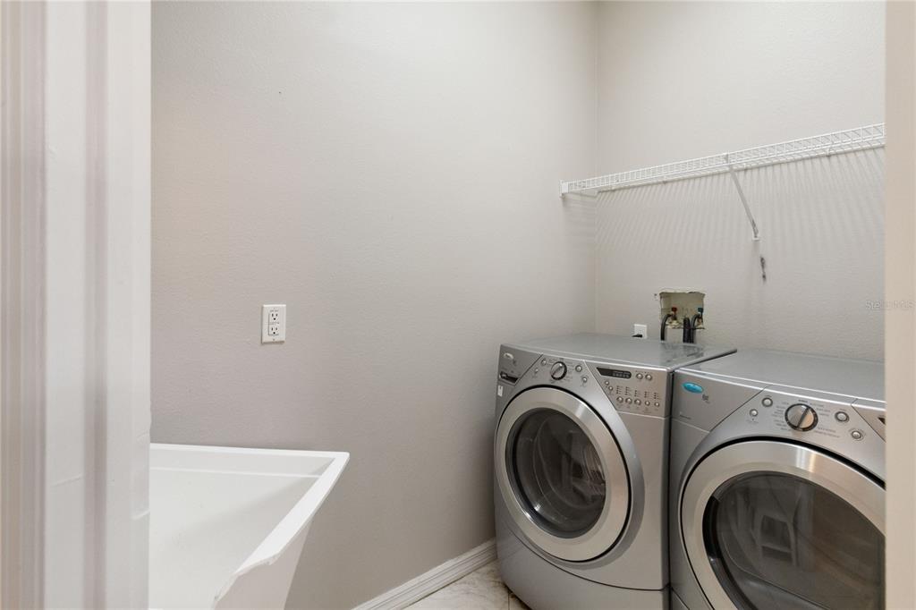 11322 Rapallo Lane Windermere, FL 34786 - Photo 25 of 39 a utility room with dryer and washer
