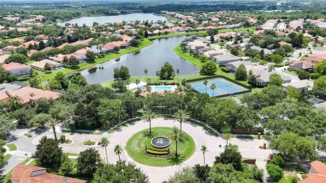 an aerial view of a house with yard
