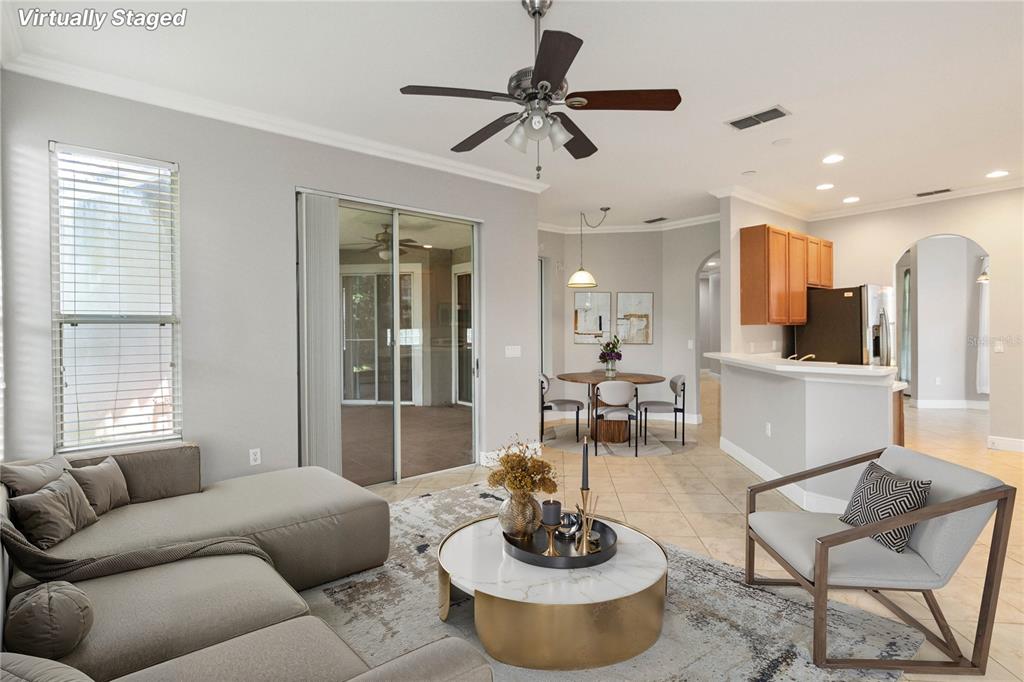 11322 Rapallo Lane Windermere, FL 34786 - Photo 3 of 39 a living room with furniture kitchen and a window