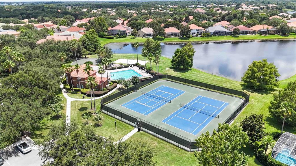 11322 Rapallo Lane Windermere, FL 34786 - Photo 32 of 39 an aerial view of a house with a garden and lake view