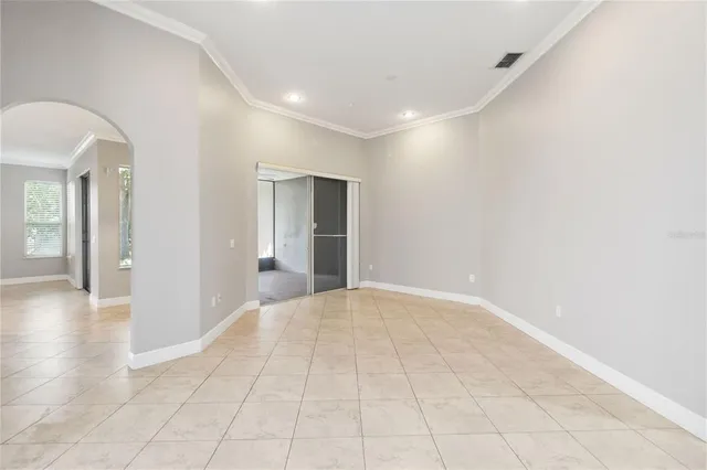 a view of an empty room with glass door