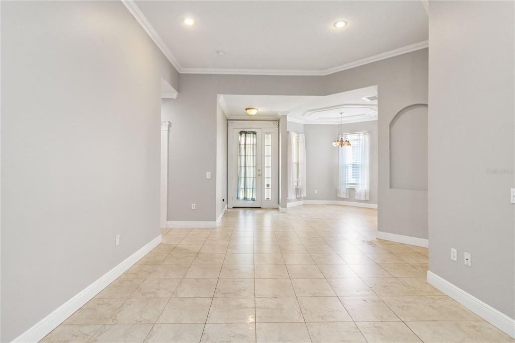 11322 Rapallo Lane Windermere, FL 34786 - Photo 6 of 39 a view of an empty room with glass door