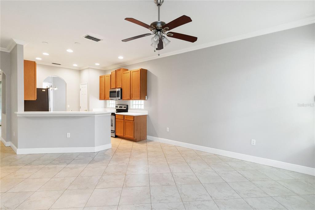 11322 Rapallo Lane Windermere, FL 34786 - Photo 10 of 39 a view of kitchen with stainless steel appliances cabinets and large window