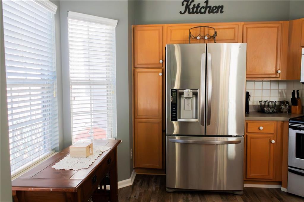 50 Berkeley Place Cartersville, GA 30121 - Photo 13 of 54 a kitchen with stainless steel appliances a refrigerator and a stove