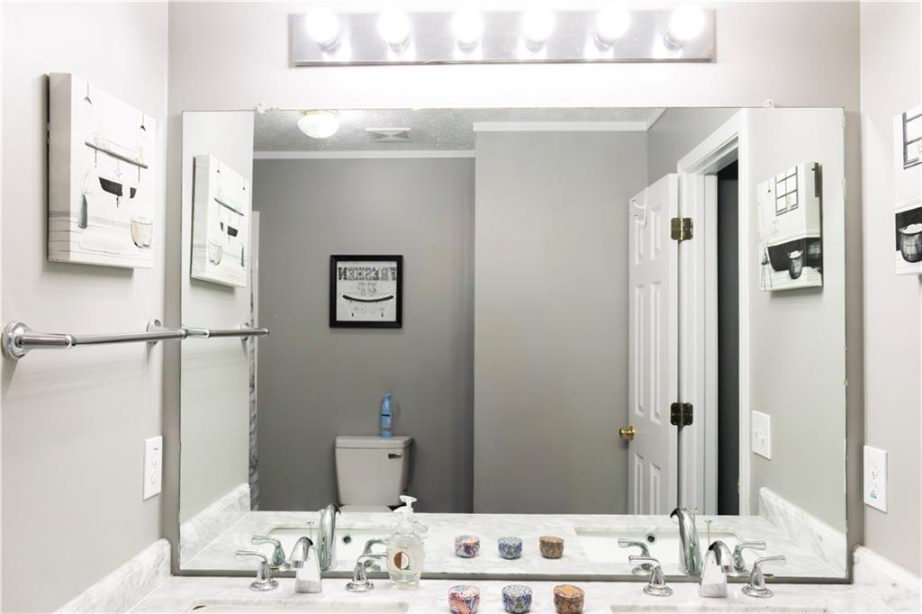 50 Berkeley Place Cartersville, GA 30121 - Photo 35 of 54 a bathroom with a granite countertop sink and a mirror