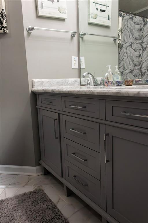 50 Berkeley Place Cartersville, GA 30121 - Photo 36 of 54 a bathroom with a granite countertop sink and a mirror