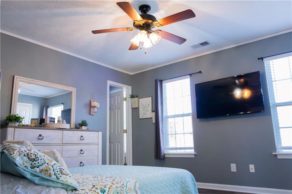 50 Berkeley Place Cartersville, GA 30121 - Photo 44 of 54 a bedroom with a bed and a flat screen tv