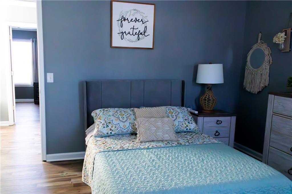 50 Berkeley Place Cartersville, GA 30121 - Photo 45 of 54 a bedroom with a bed and wooden floor