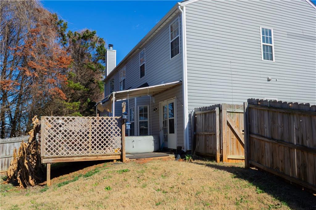 50 Berkeley Place Cartersville, GA 30121 - Photo 48 of 54 a view of a wooden house with a large window and wooden fence