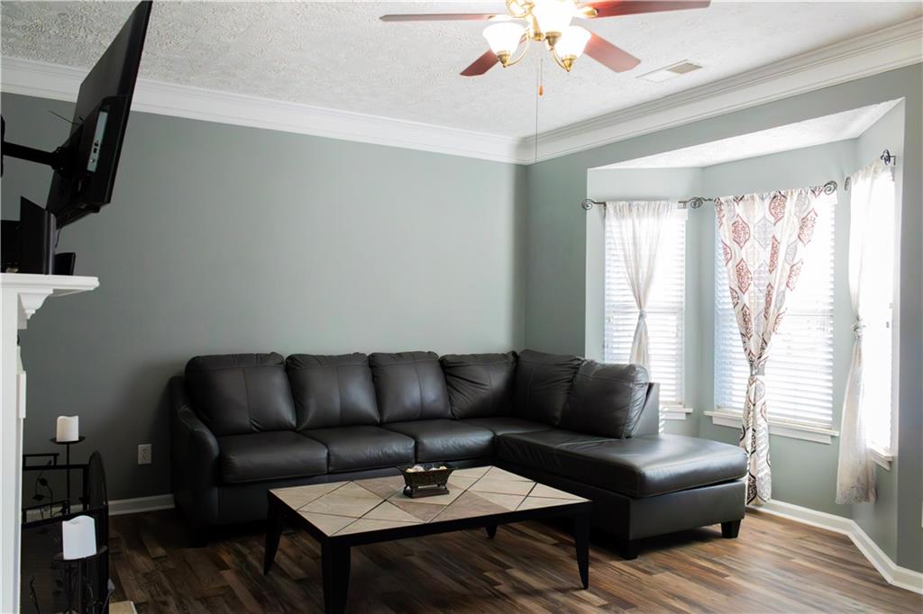 50 Berkeley Place Cartersville, GA 30121 - Photo 5 of 54 a living room with furniture and a large window