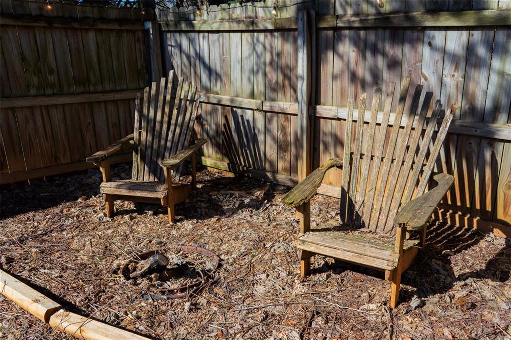50 Berkeley Place Cartersville, GA 30121 - Photo 51 of 54 a view of a backyard with a wooden bench