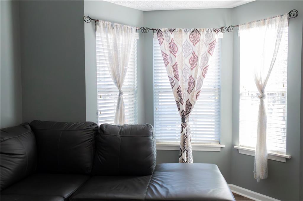 50 Berkeley Place Cartersville, GA 30121 - Photo 6 of 54 a living room with furniture and a large window